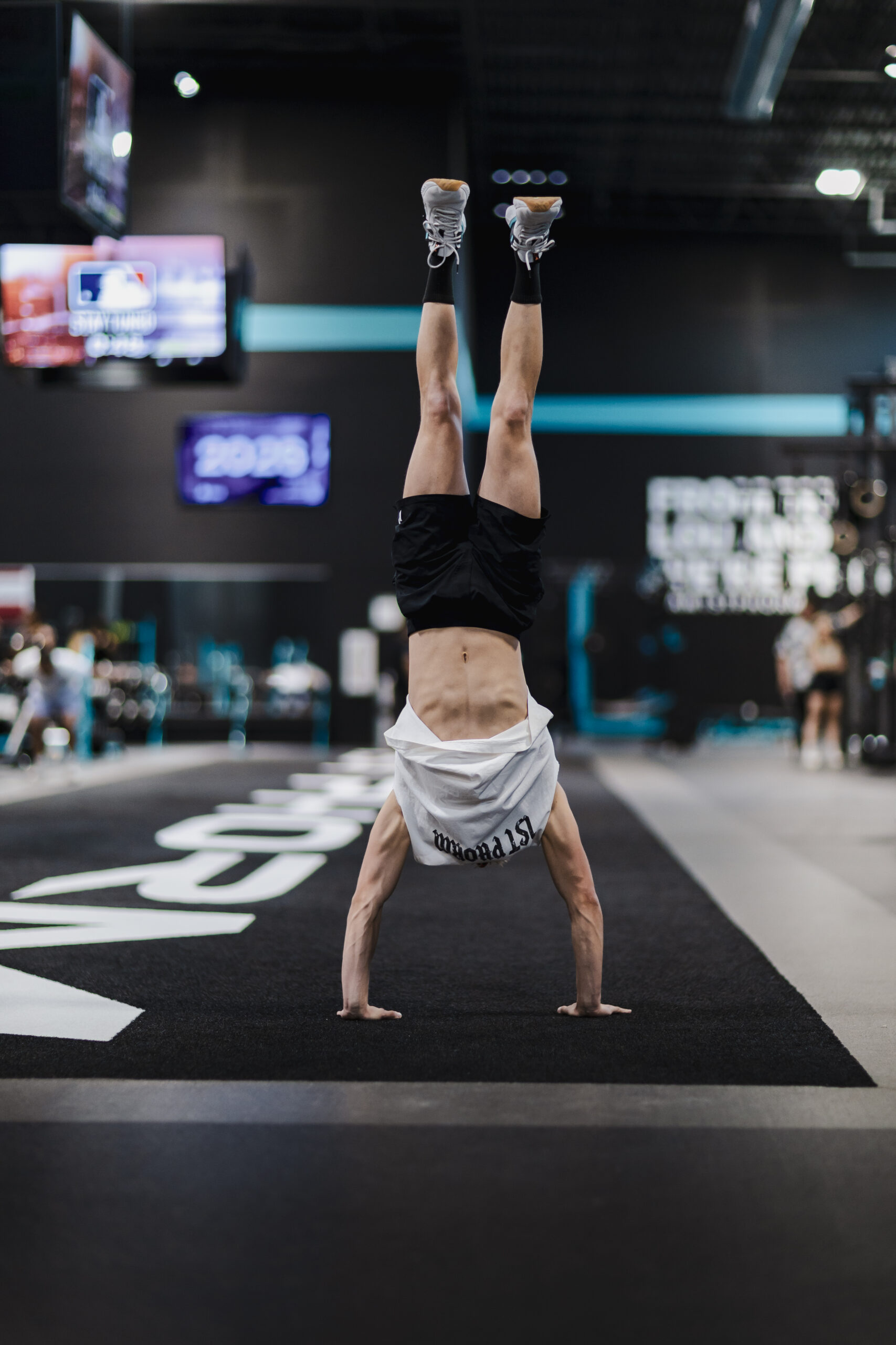 Athlete performing a handstand demonstrating strength, stability, and body control for a Lake Country Training article about core training.