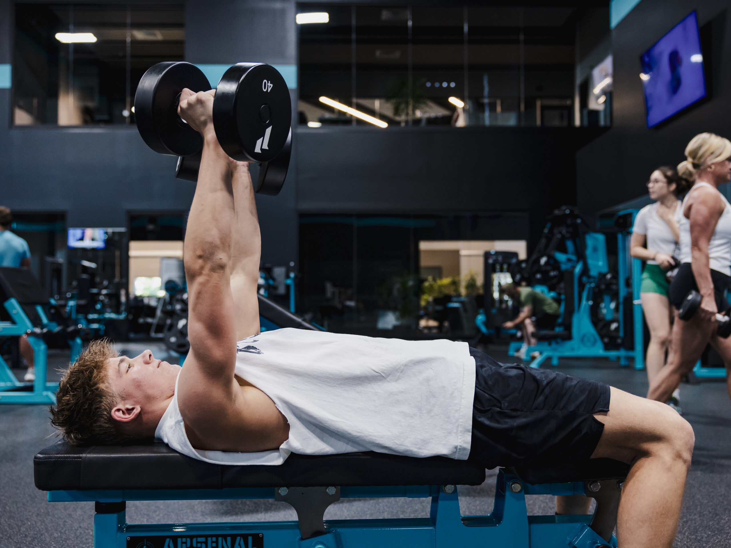 Personal trainer coaching a client through a customized strength training workout at Lake Country Training.