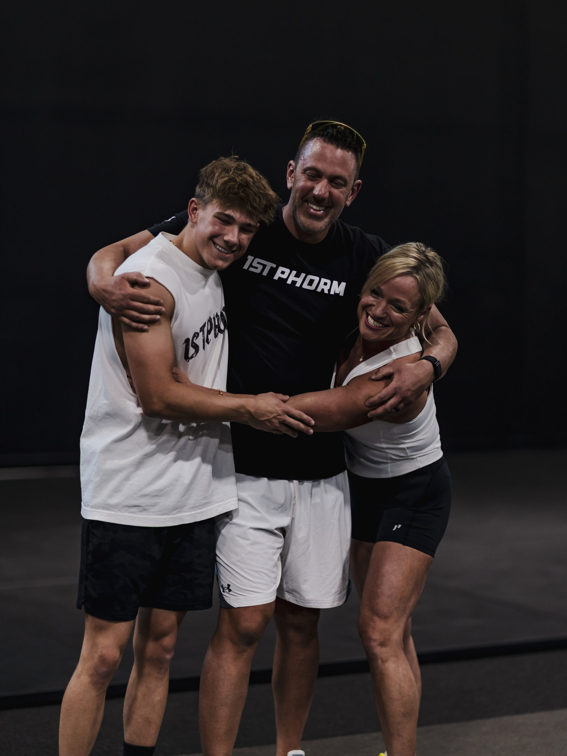Matthew, Kelly, and Lukas Meyer, the family behind Lake Country Training, united by a shared passion for helping others improve their health, fitness, and quality of life.